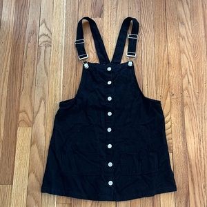 Black overall dress with pockets
